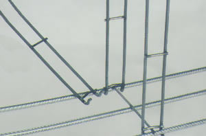 Trench mesh spacer is installed to form a rigid cage